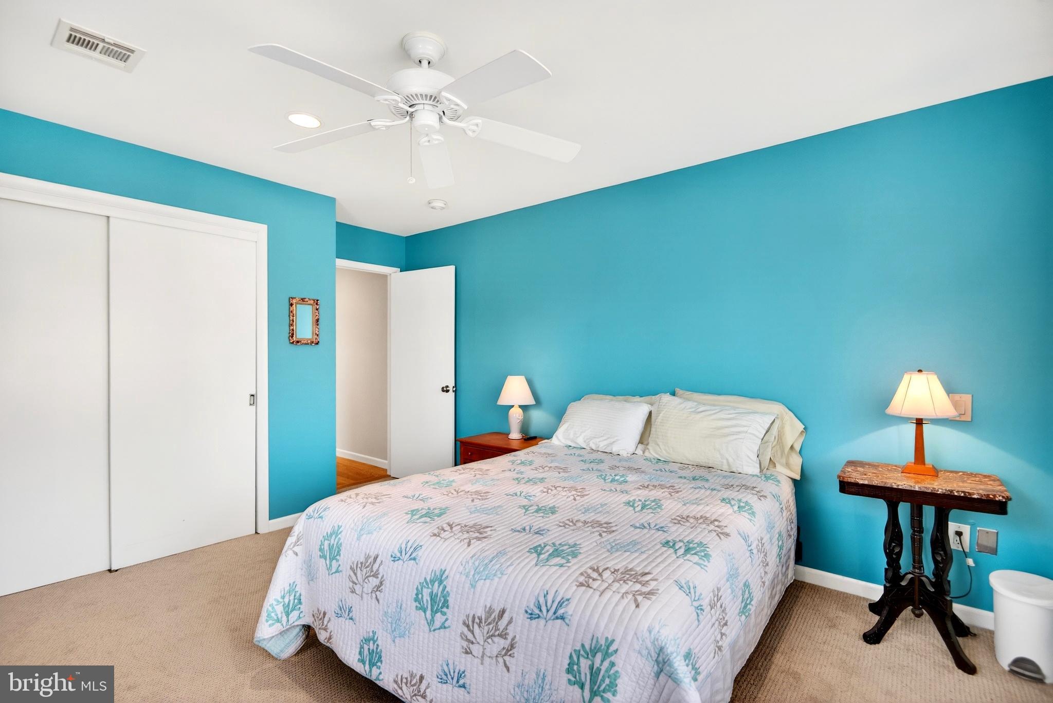 20 Edgewater Drive Tuckerton, NJ 08087 - Photo 45 of 78 a bedroom with a bed and a chandelier