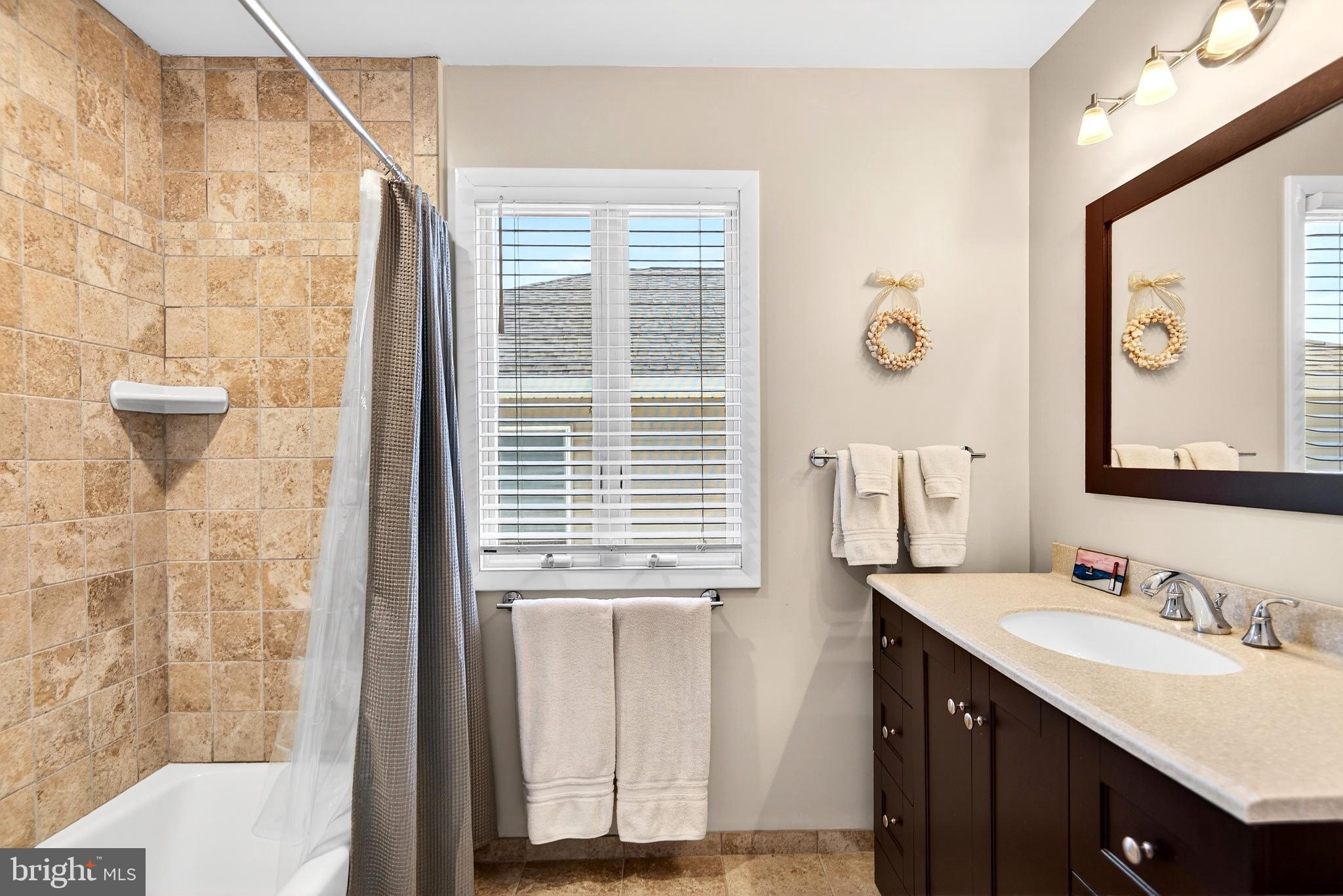 20 Edgewater Drive Tuckerton, NJ 08087 - Photo 46 of 78 a bathroom with a sink a toilet and a mirror