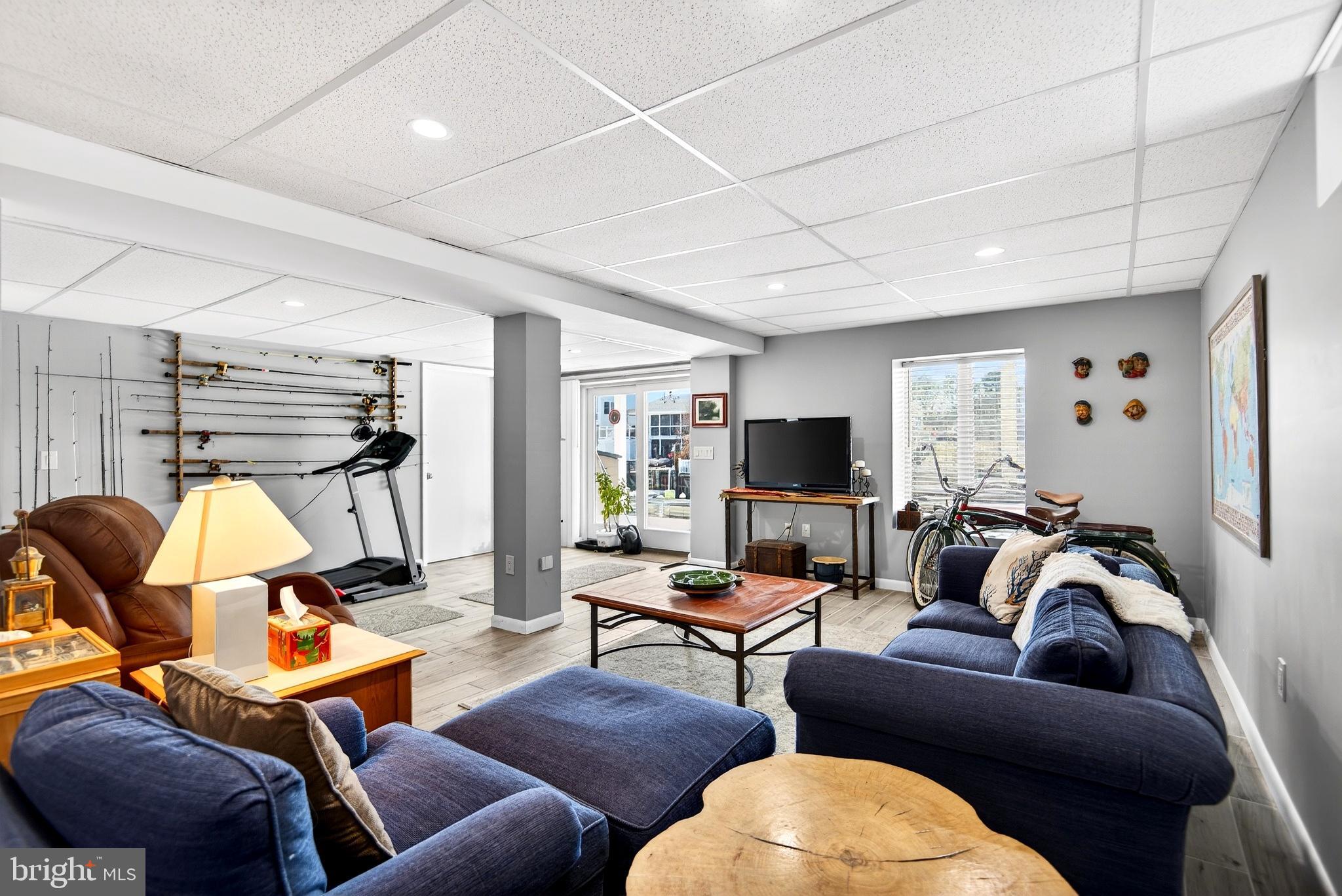 20 Edgewater Drive Tuckerton, NJ 08087 - Photo 49 of 78 a living room with furniture a rug and a flat screen tv
