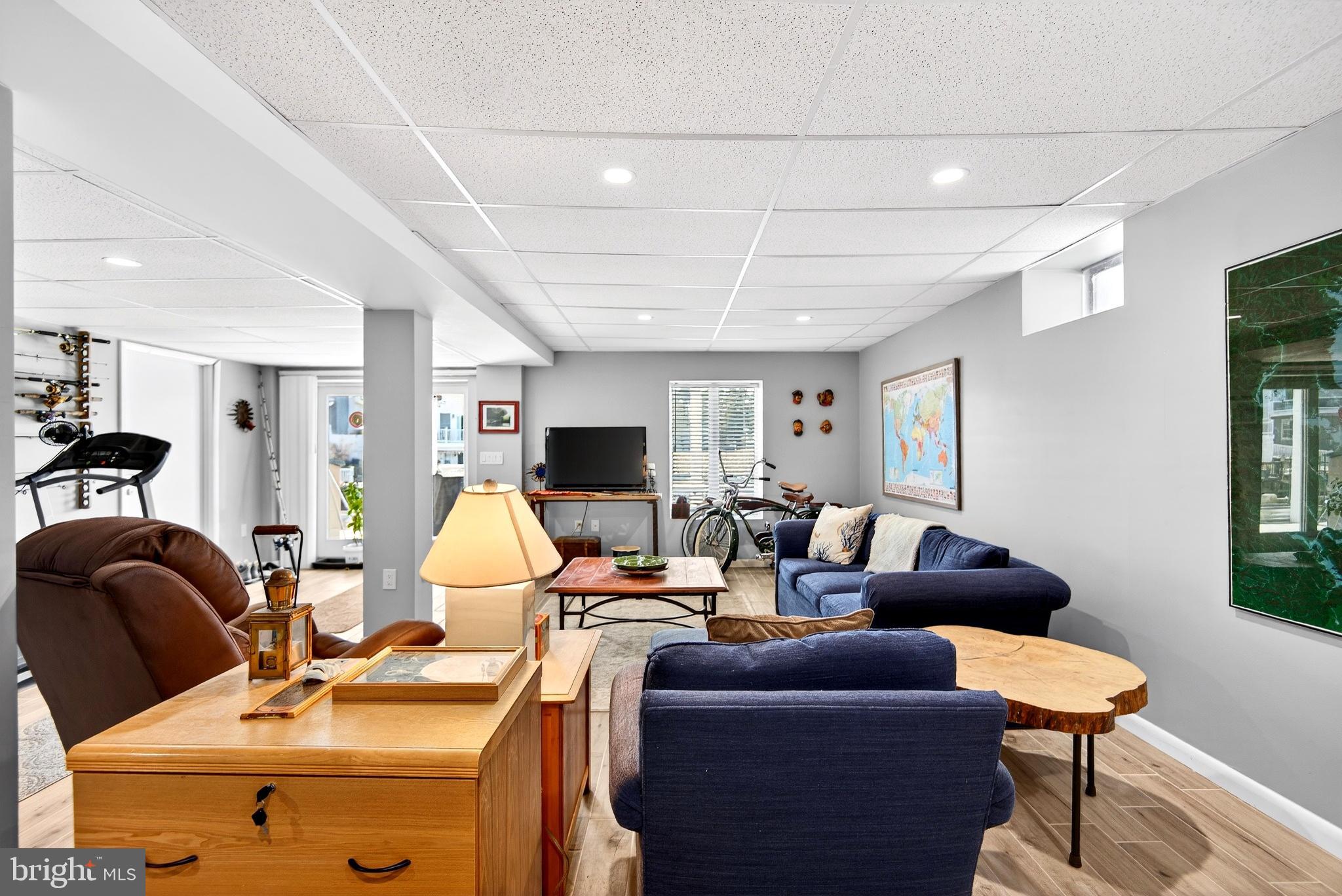 20 Edgewater Drive Tuckerton, NJ 08087 - Photo 50 of 78 a living room with furniture a lamp wooden floor and a window