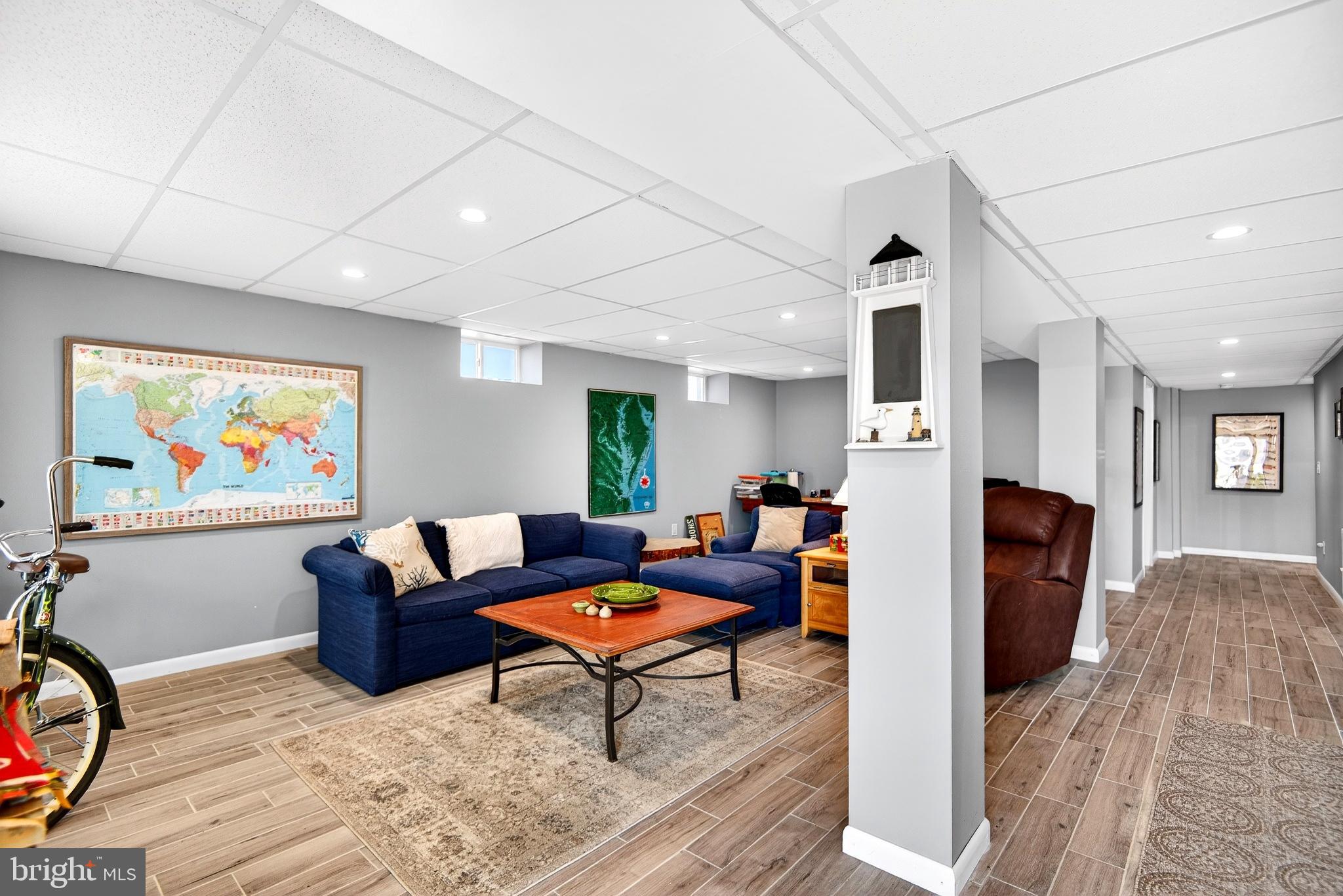 20 Edgewater Drive Tuckerton, NJ 08087 - Photo 51 of 78 a living room with furniture a flat screen tv and a refrigerator