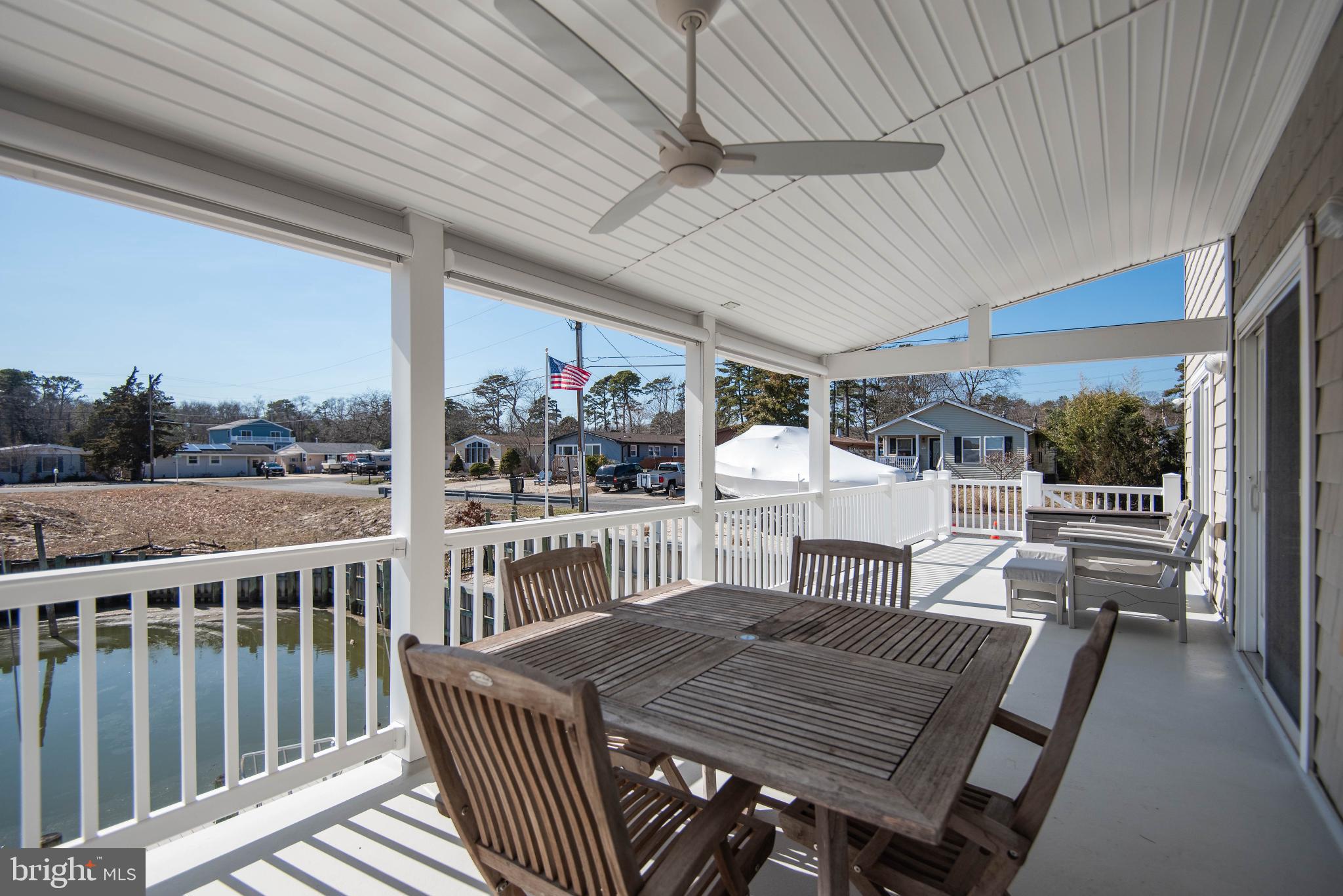 20 Edgewater Drive Tuckerton, NJ 08087 - Photo 63 of 78 a view of a patio with a table chairs and a patio