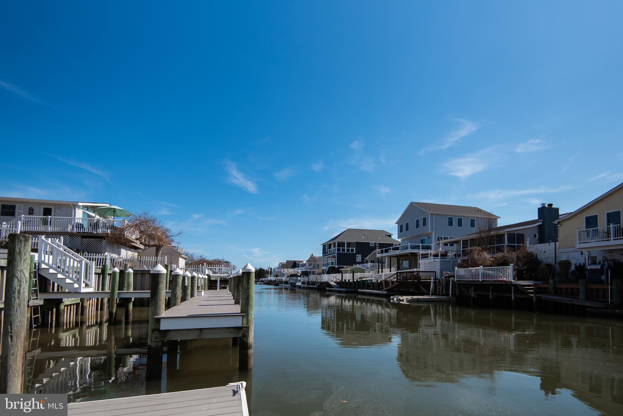 20 Edgewater Drive Tuckerton, NJ 08087 - Photo 74 of 78 Serene waterfront homes under a clear sky.