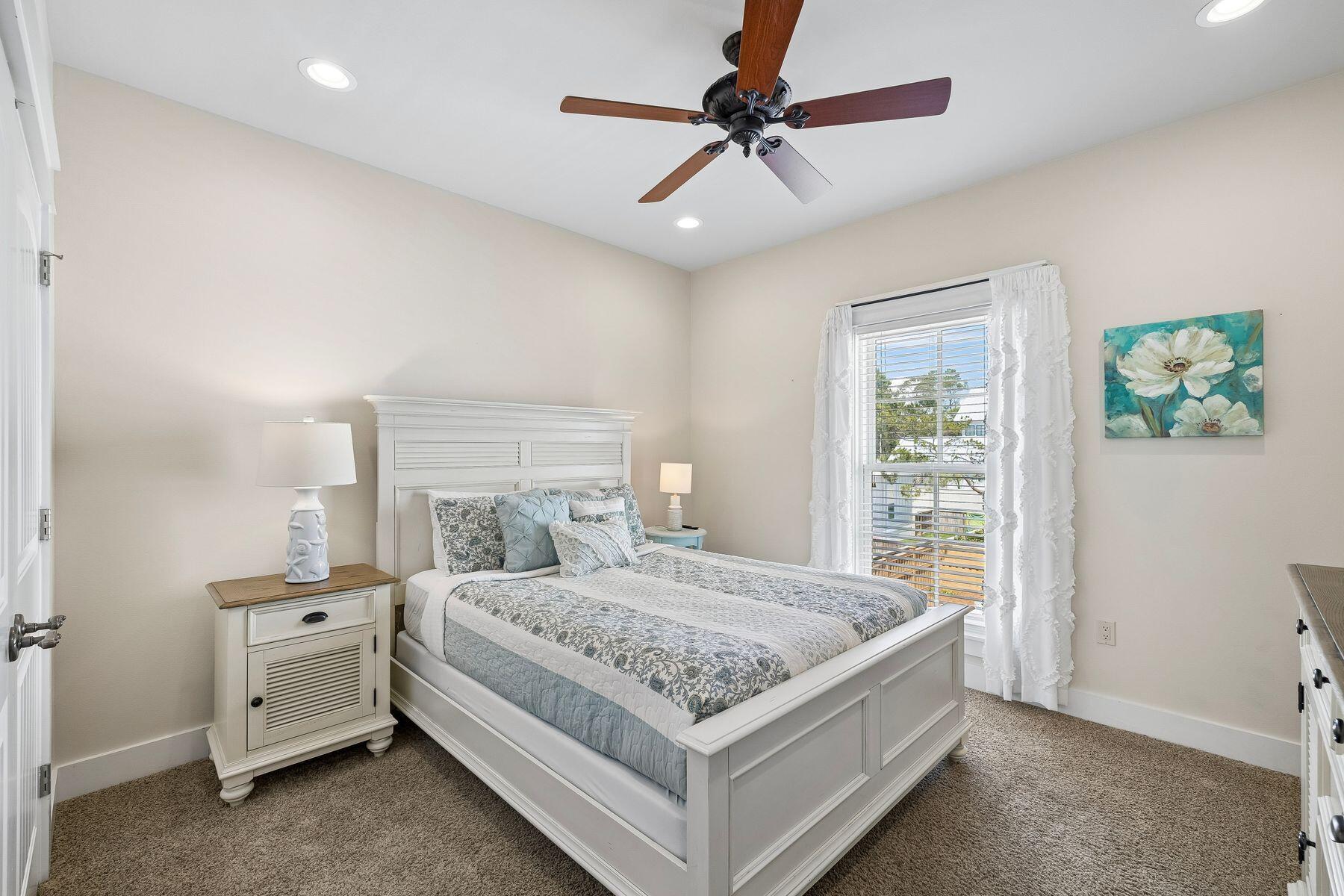 39 Willow Mist Road Inlet Beach, FL 32461 - Photo 19 of 41 a bedroom with a bed a ceiling fan and a dresser