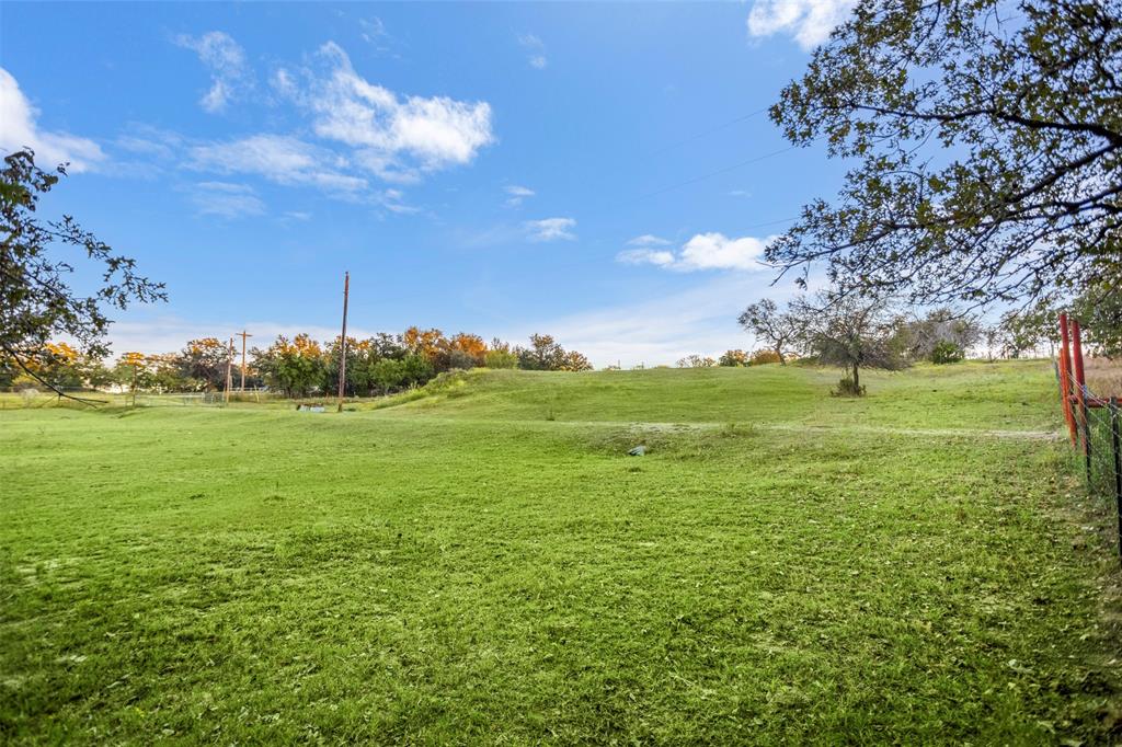 199 Cheyenne Trail Springtown, TX 76082 - Photo 5 of 22 a view of a field with an trees