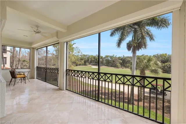 a view of a porch with a table and chairs