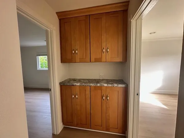 a view of a storage and utility room in a kitchen