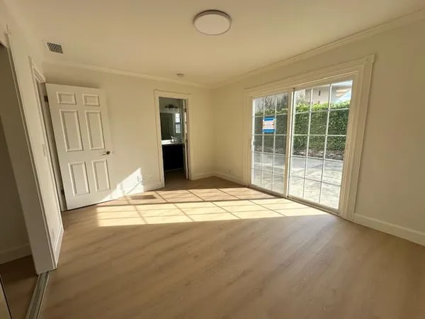 a view of empty room with floor to ceiling window
