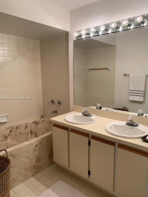 513 Racquet Club Road, Unit 55 Weston, FL 33326 - Photo 12 of 25 a bathroom with a tub sink and mirror