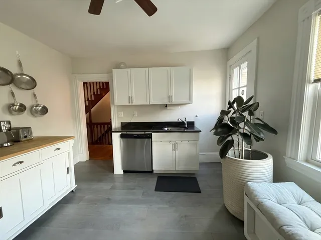 a kitchen with a sink and cabinets