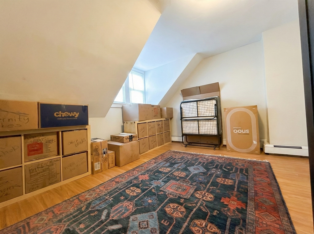20 Fellsway West, Unit 2 Somerville, MA 02145 - Photo 13 of 17 a view of a livingroom with wooden floor and furniture