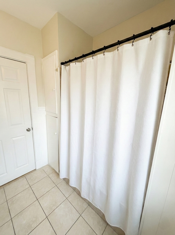 20 Fellsway West, Unit 2 Somerville, MA 02145 - Photo 15 of 17 a view of a bathroom with a shower and a sink