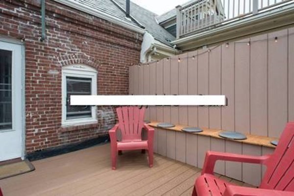 20 Fellsway West, Unit 2 Somerville, MA 02145 - Photo 17 of 17 a backyard of a house with outdoor seating