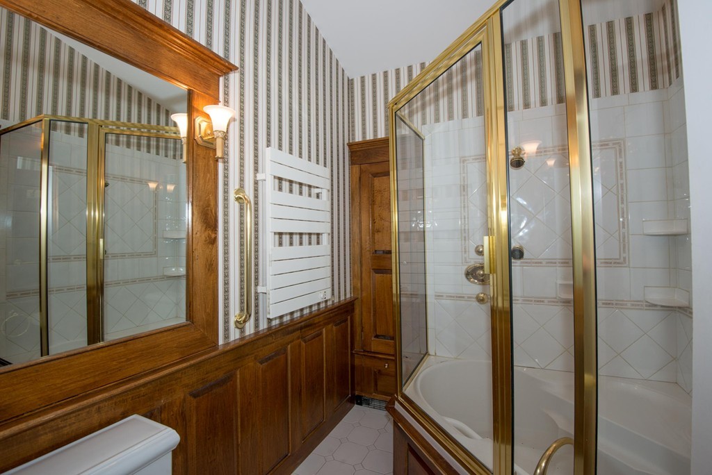 9 Fatima Road Stoneham, MA 02180 - Photo 16 of 26 a bathroom with a shower and a sink