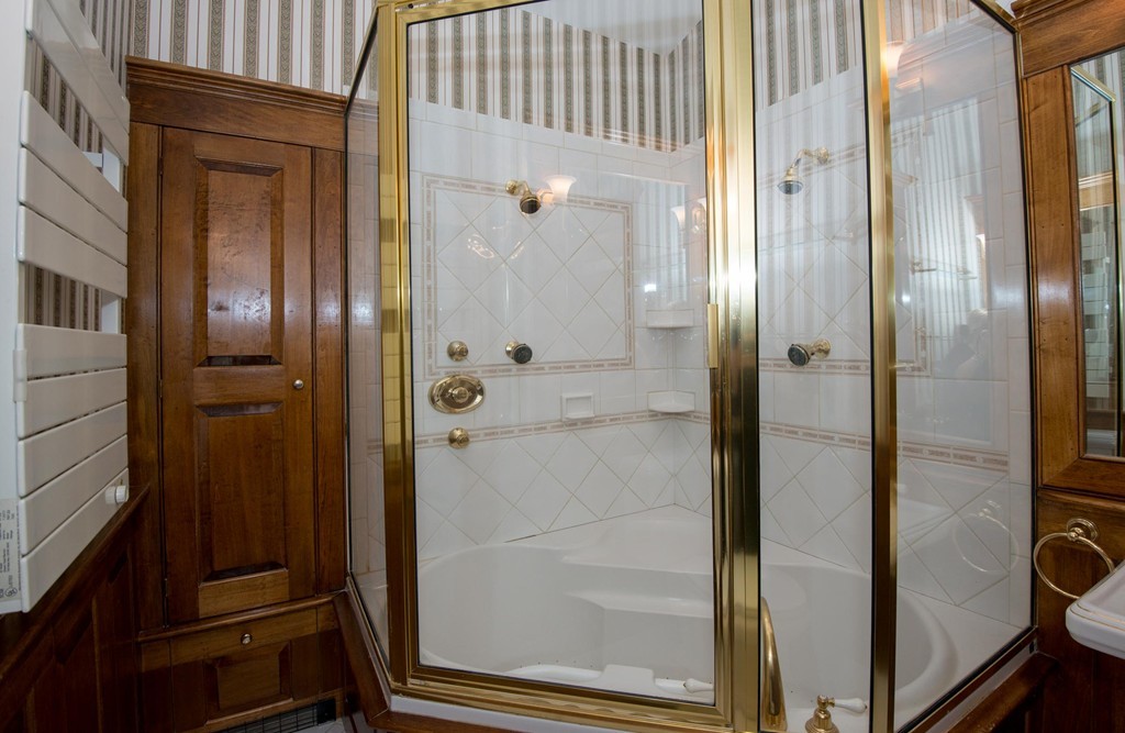 9 Fatima Road Stoneham, MA 02180 - Photo 17 of 26 a bathroom with a glass door shower