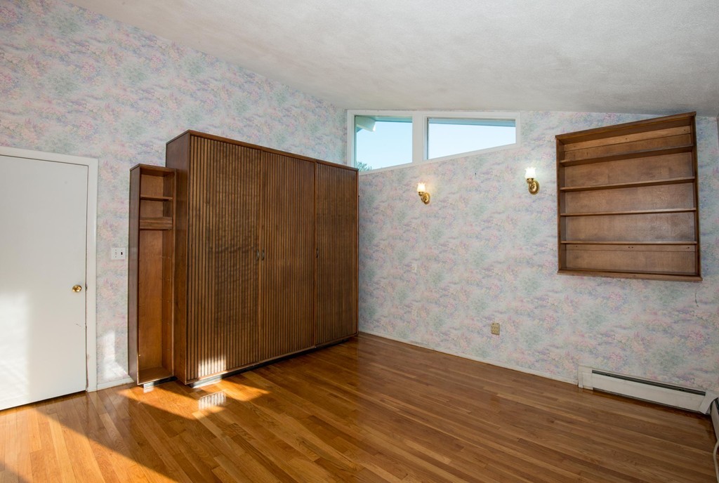 9 Fatima Road Stoneham, MA 02180 - Photo 19 of 26 a view of an empty room with wooden floor