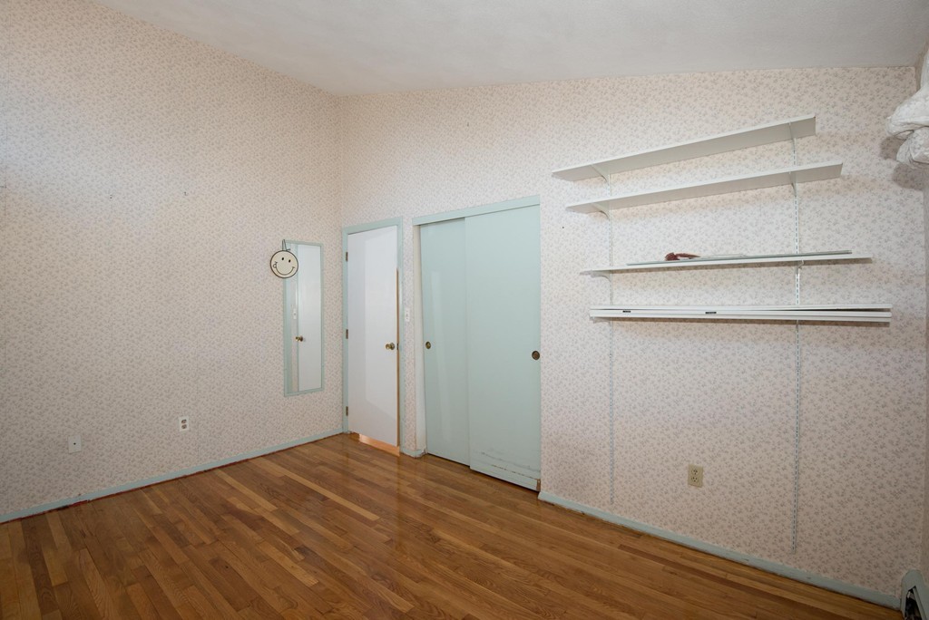 9 Fatima Road Stoneham, MA 02180 - Photo 21 of 26 a view of empty room with wooden floor