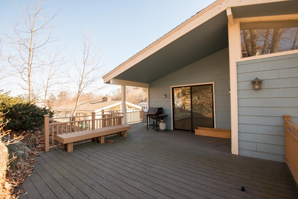 9 Fatima Road Stoneham, MA 02180 - Photo 5 of 26 a view of a balcony with couch and wooden floor