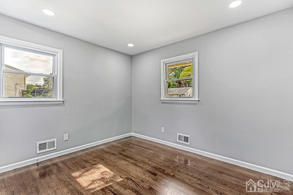 187 1st Street Middlesex, NJ 08846 - Photo 16 of 23 a view of room with window and wooden floor