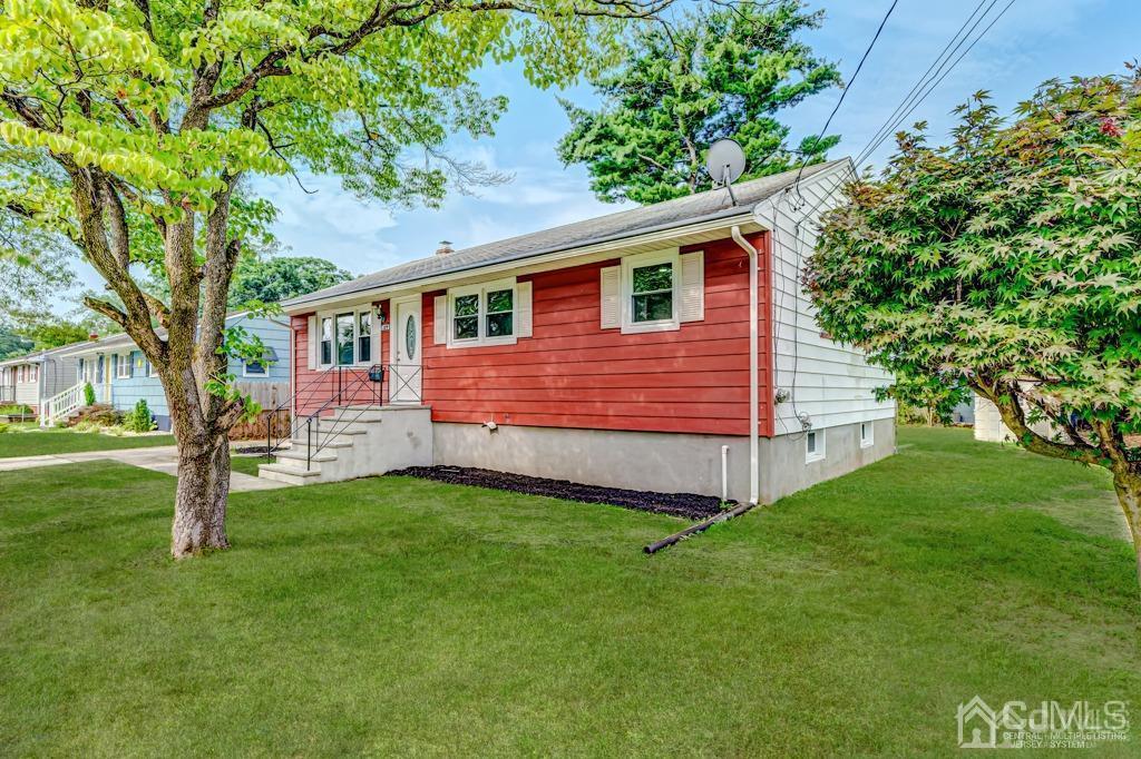 187 1st Street Middlesex, NJ 08846 - Photo 2 of 23 a front view of a house with a yard