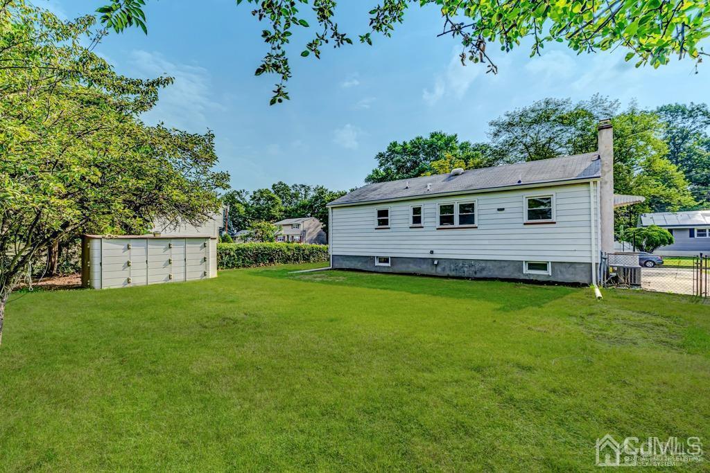 187 1st Street Middlesex, NJ 08846 - Photo 21 of 23 a front view of a house with garden
