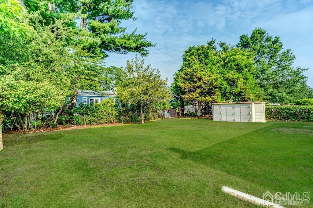 187 1st Street Middlesex, NJ 08846 - Photo 22 of 23 a view of a tiny house with a yard