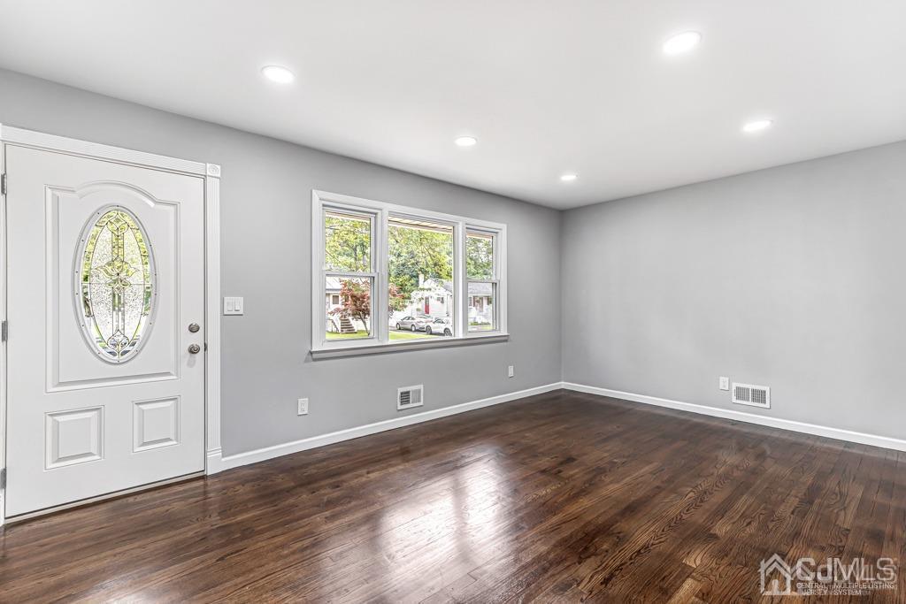 187 1st Street Middlesex, NJ 08846 - Photo 4 of 23 an empty room with wooden floor and window