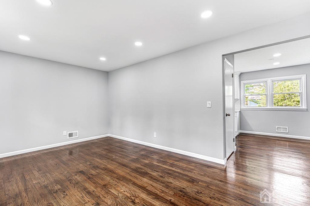 187 1st Street Middlesex, NJ 08846 - Photo 6 of 23 a view of room with window and wooden floor