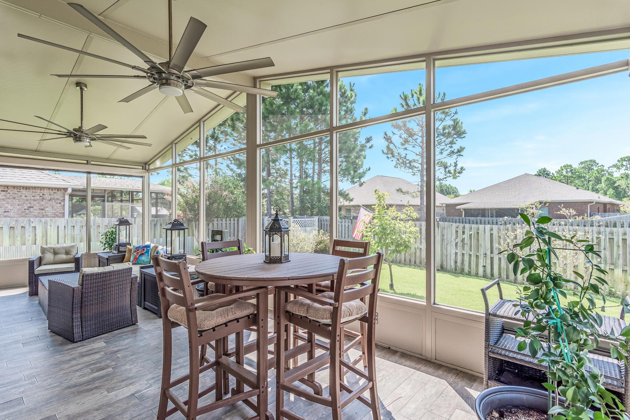 446 Pin Oak Loop Santa Rosa Beach, FL 32459 - Photo 11 of 48 a view of a dining room with furniture window and outside view