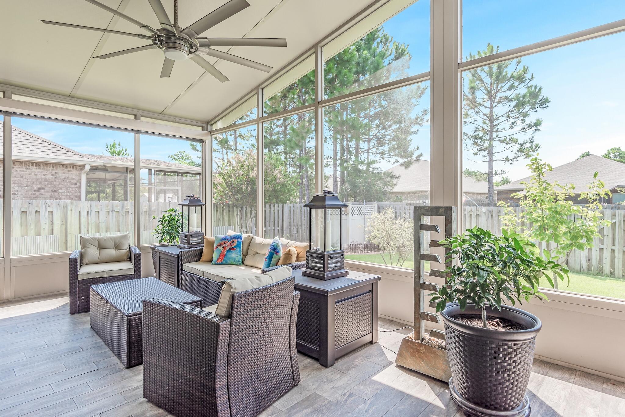 446 Pin Oak Loop Santa Rosa Beach, FL 32459 - Photo 12 of 48 a living room with furniture and a potted plant