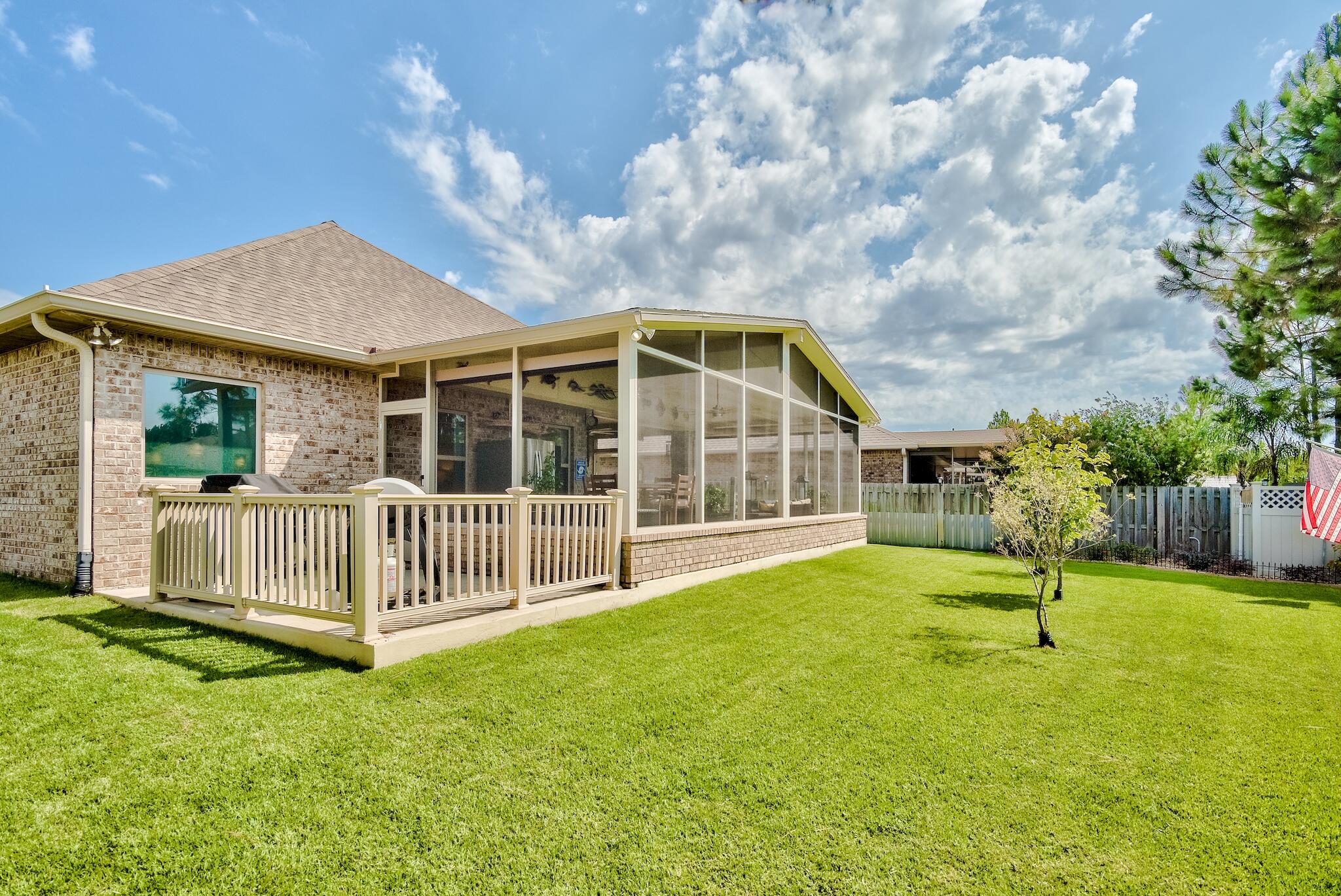 446 Pin Oak Loop Santa Rosa Beach, FL 32459 - Photo 14 of 48 a view of a house with a backyard and porch