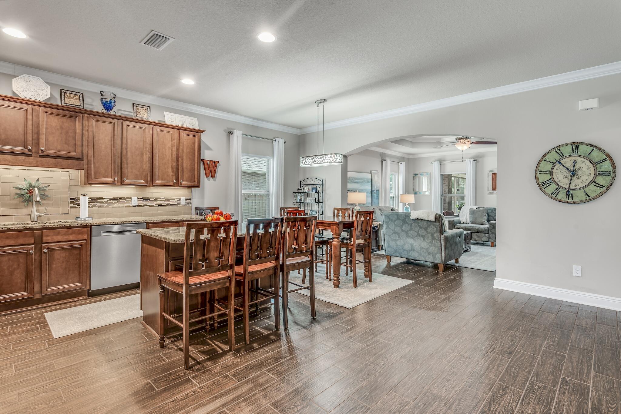 446 Pin Oak Loop Santa Rosa Beach, FL 32459 - Photo 19 of 48 a large kitchen with a table and chairs
