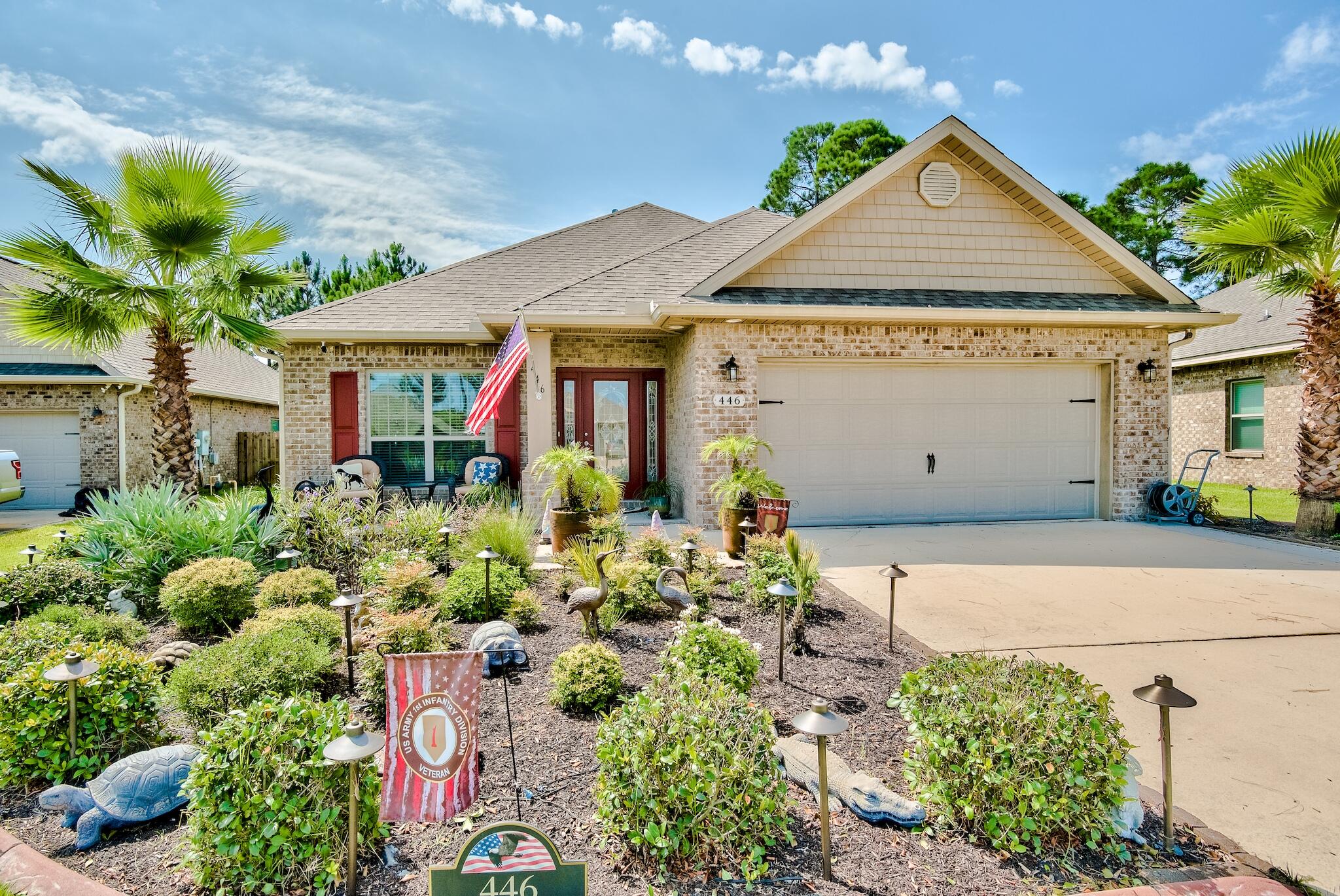 446 Pin Oak Loop Santa Rosa Beach, FL 32459 - Photo 2 of 48 a view of a house with potted plants