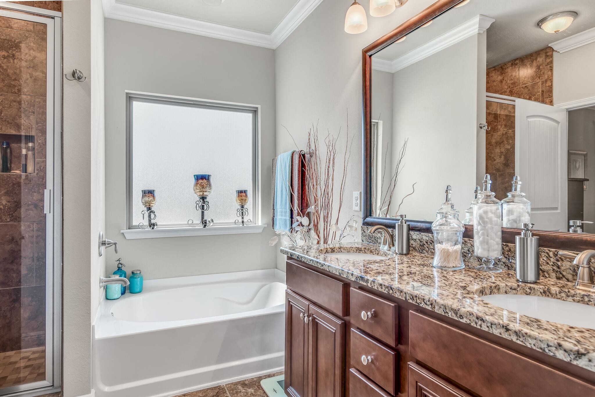 446 Pin Oak Loop Santa Rosa Beach, FL 32459 - Photo 28 of 48 a bathroom with a granite countertop sink and a mirror