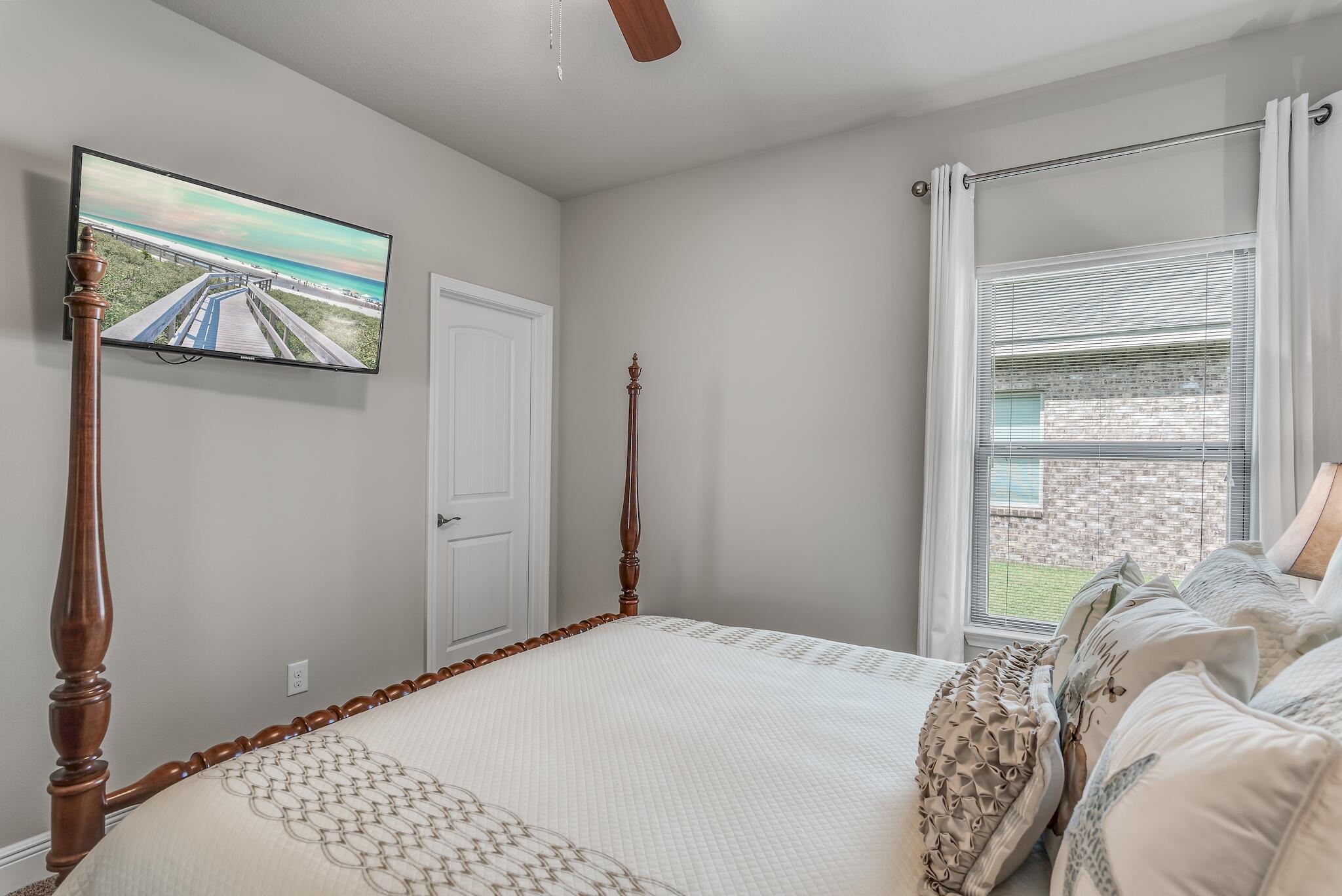 446 Pin Oak Loop Santa Rosa Beach, FL 32459 - Photo 33 of 48 a bedroom with a bed and a window