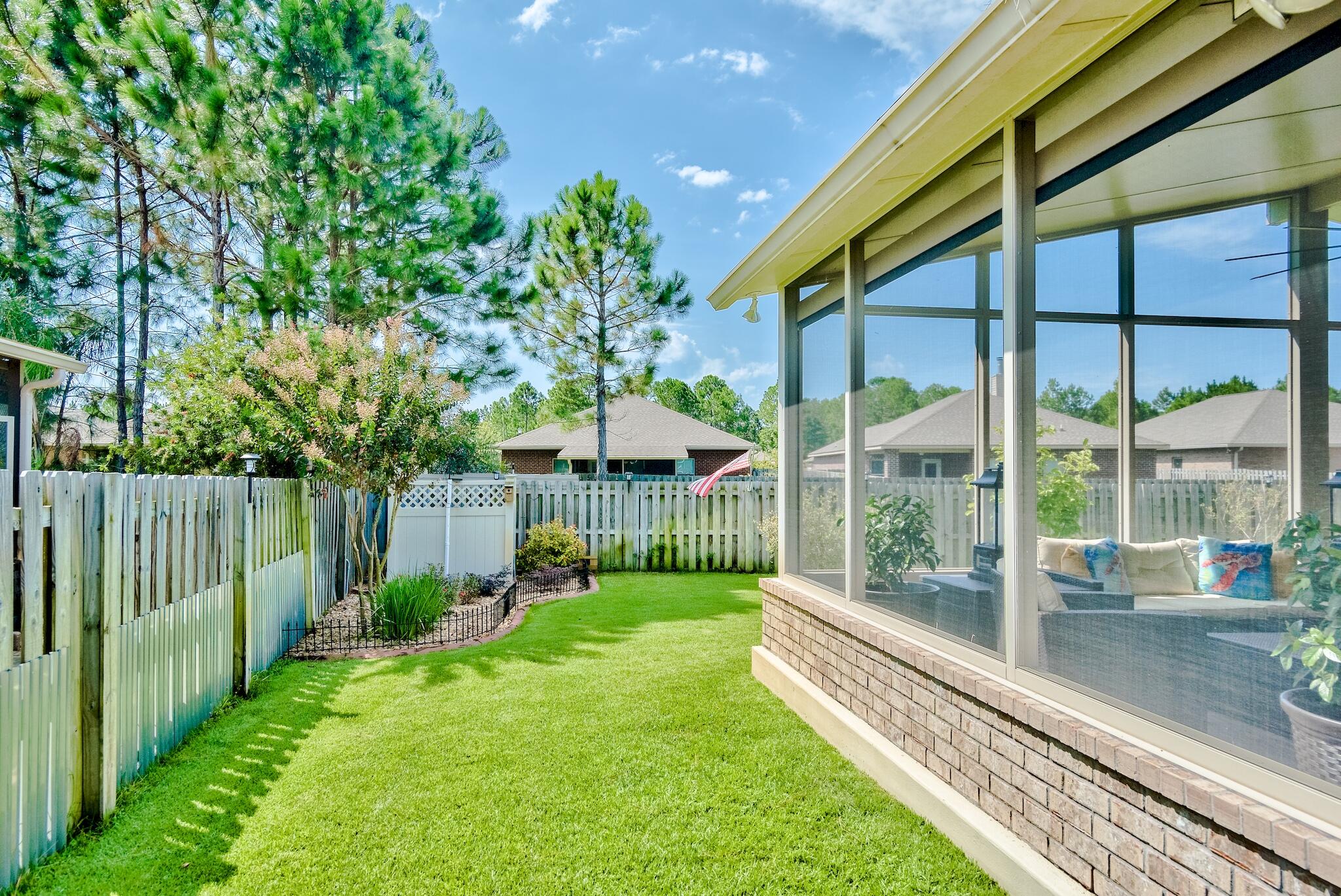 446 Pin Oak Loop Santa Rosa Beach, FL 32459 - Photo 35 of 48 a view of a house with backyard and porch