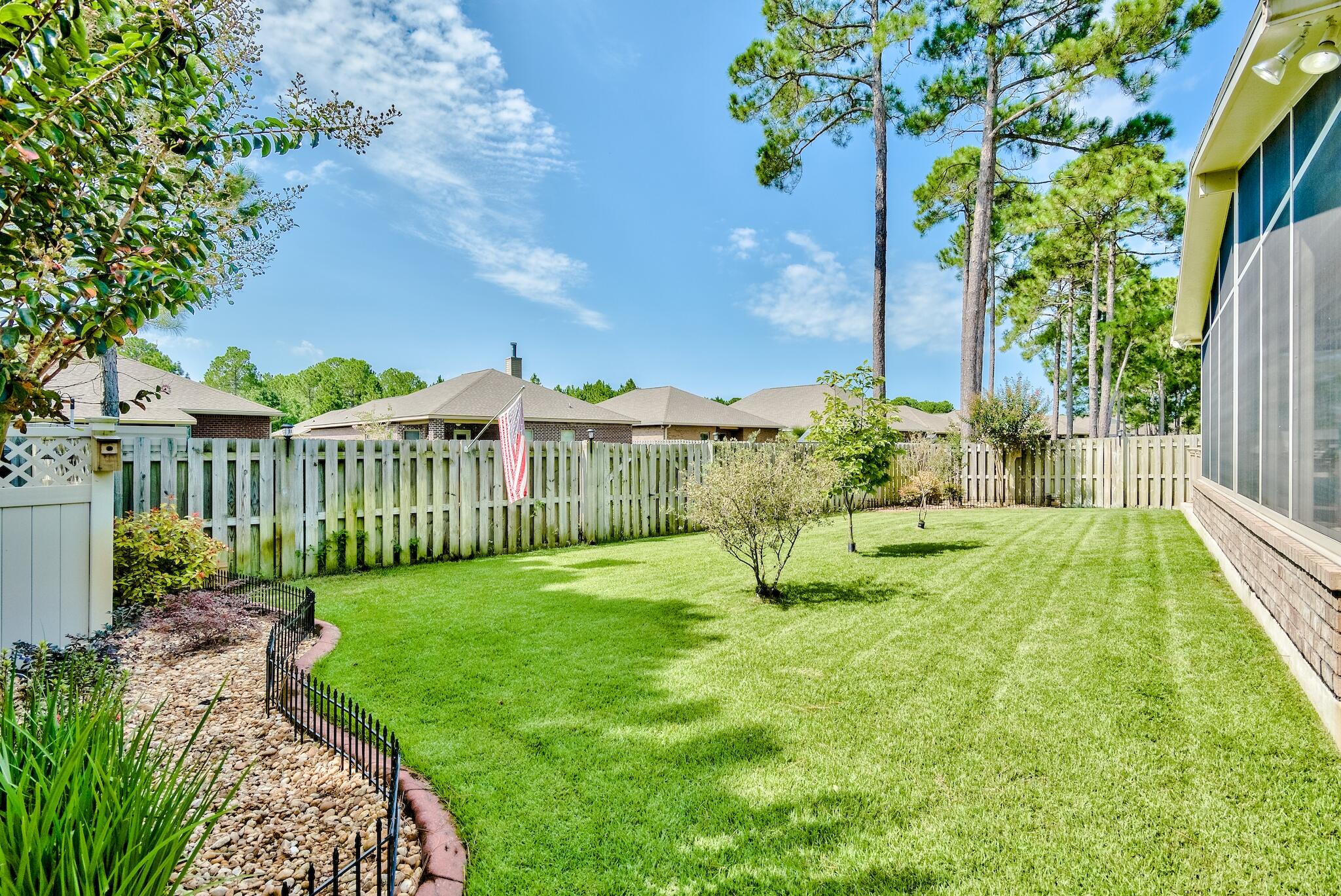446 Pin Oak Loop Santa Rosa Beach, FL 32459 - Photo 37 of 48 a view of a garden with a house