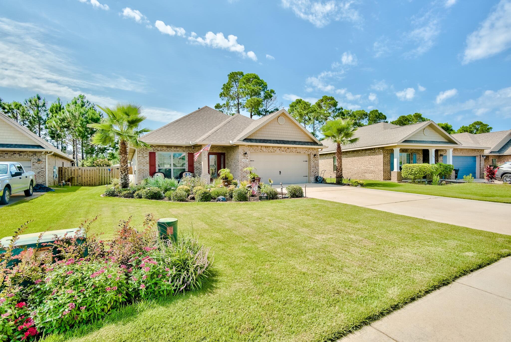 446 Pin Oak Loop Santa Rosa Beach, FL 32459 - Photo 38 of 48 a house with garden in front of it