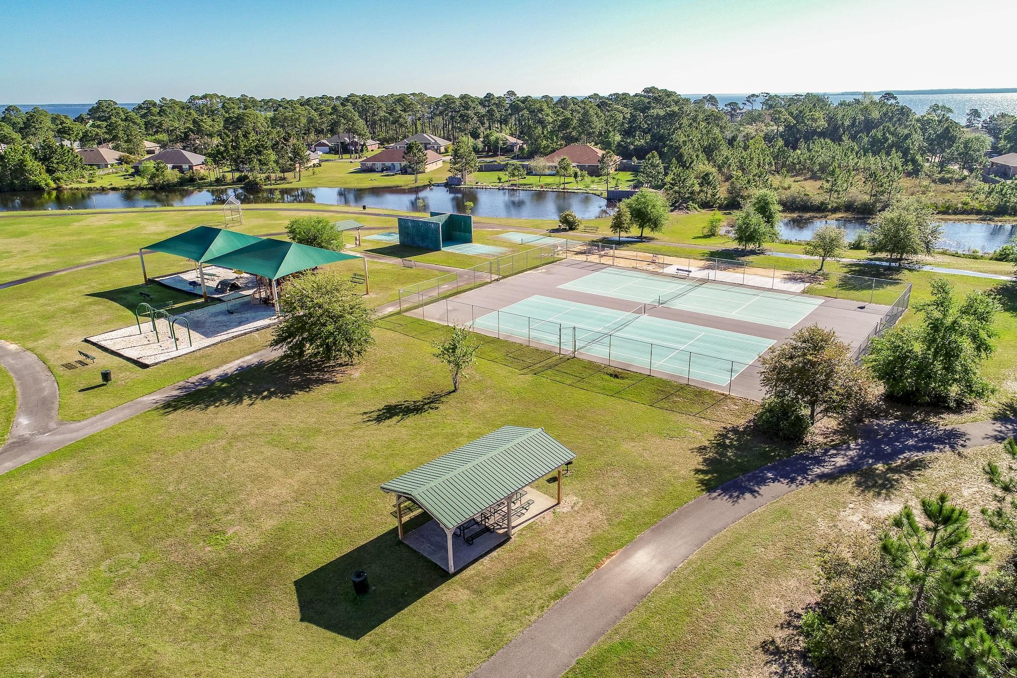 446 Pin Oak Loop Santa Rosa Beach, FL 32459 - Photo 45 of 48 a view of a swimming pool and lake view