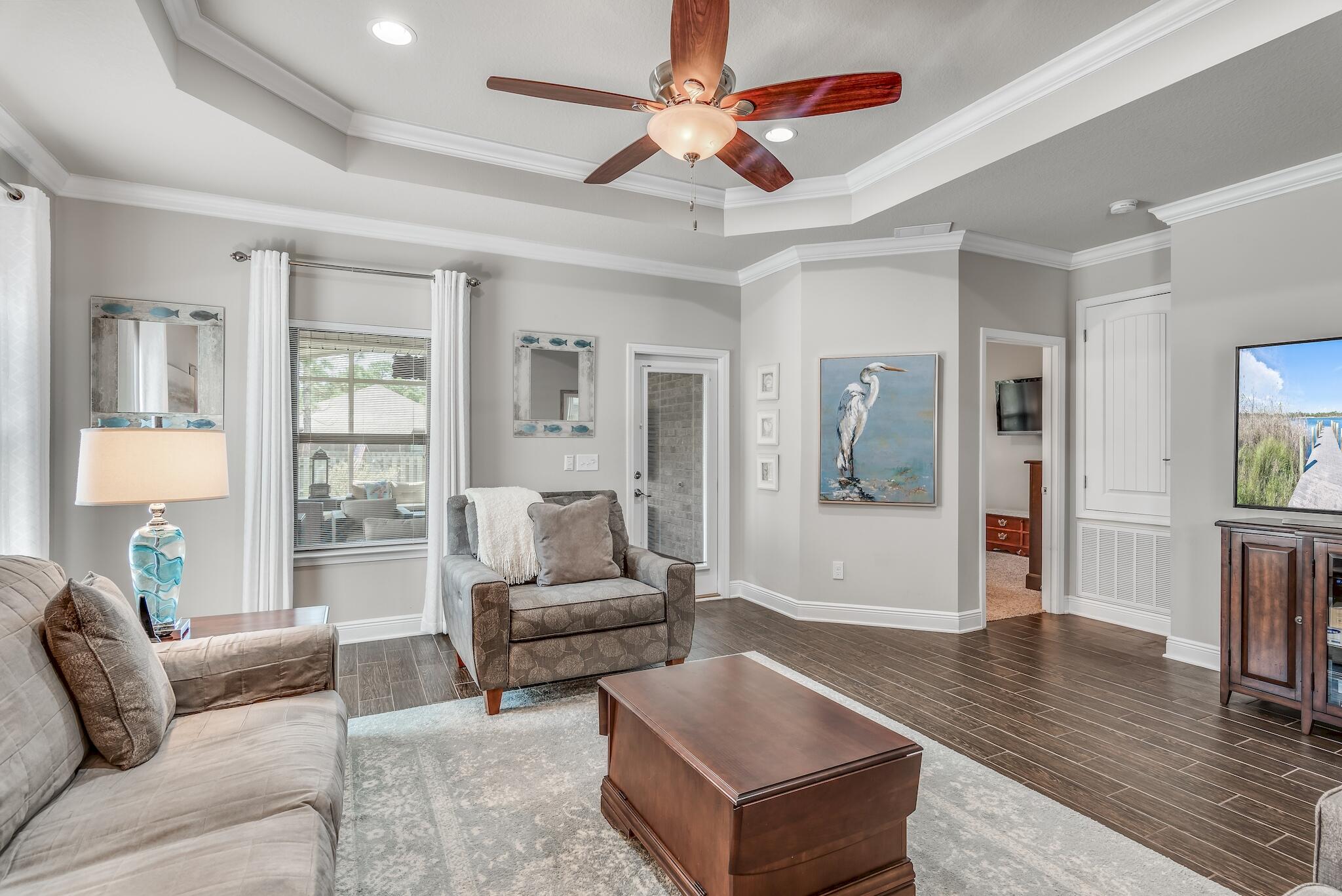 446 Pin Oak Loop Santa Rosa Beach, FL 32459 - Photo 7 of 48 a living room with furniture and a wooden floor