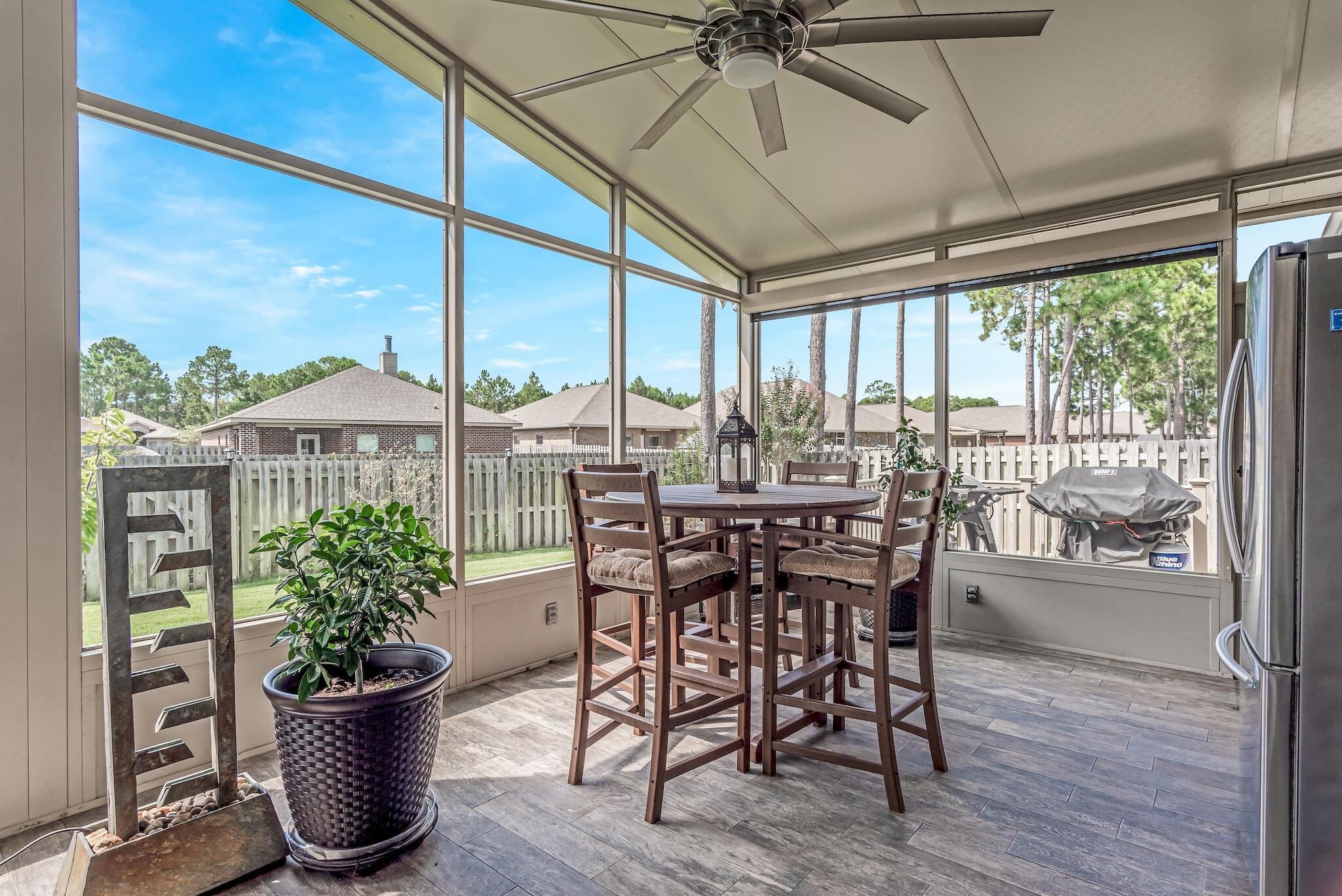 446 Pin Oak Loop Santa Rosa Beach, FL 32459 - Photo 9 of 48 a dining room with furniture window and outside view