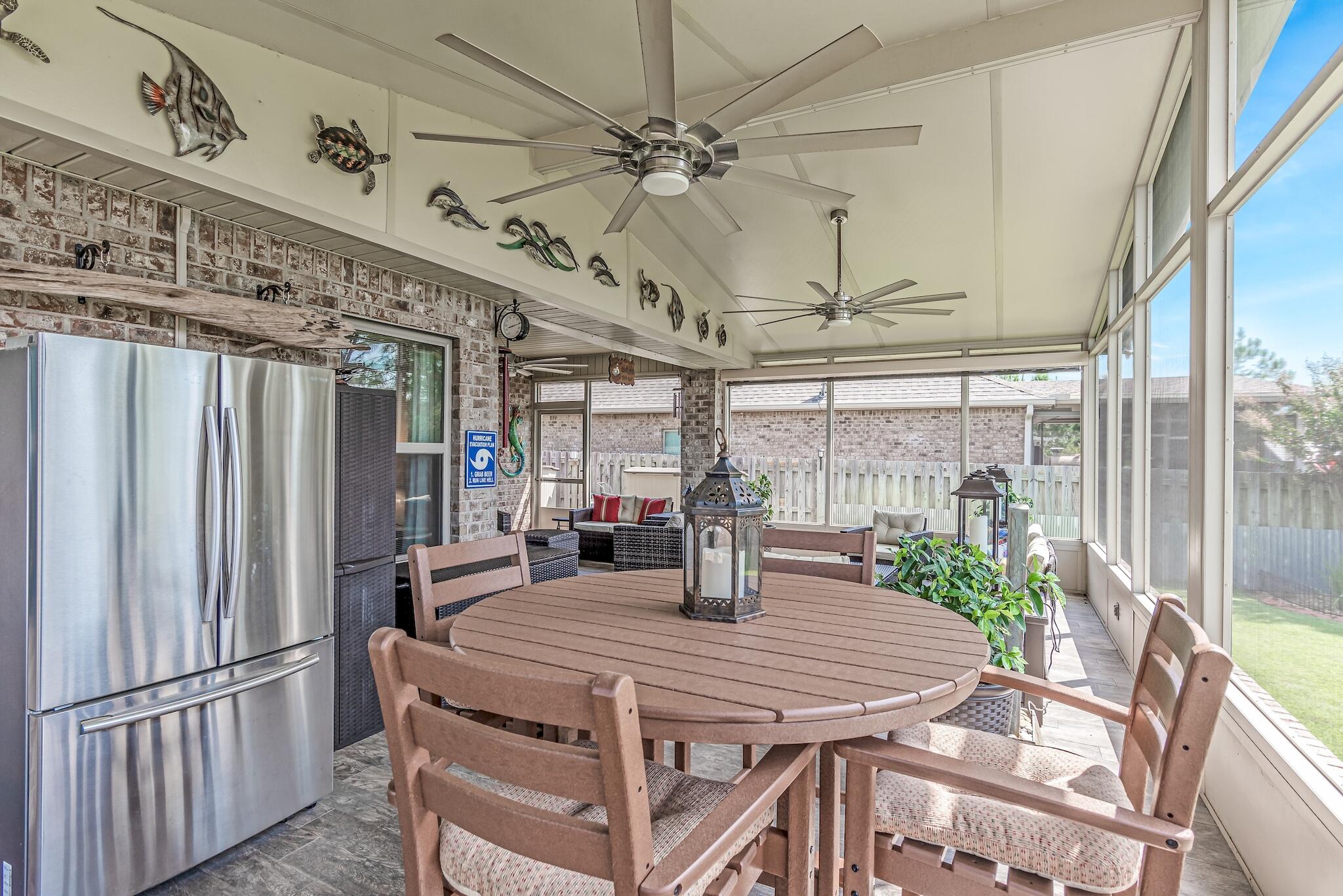 446 Pin Oak Loop Santa Rosa Beach, FL 32459 - Photo 10 of 48 a view of a dining room with furniture window and wooden floor