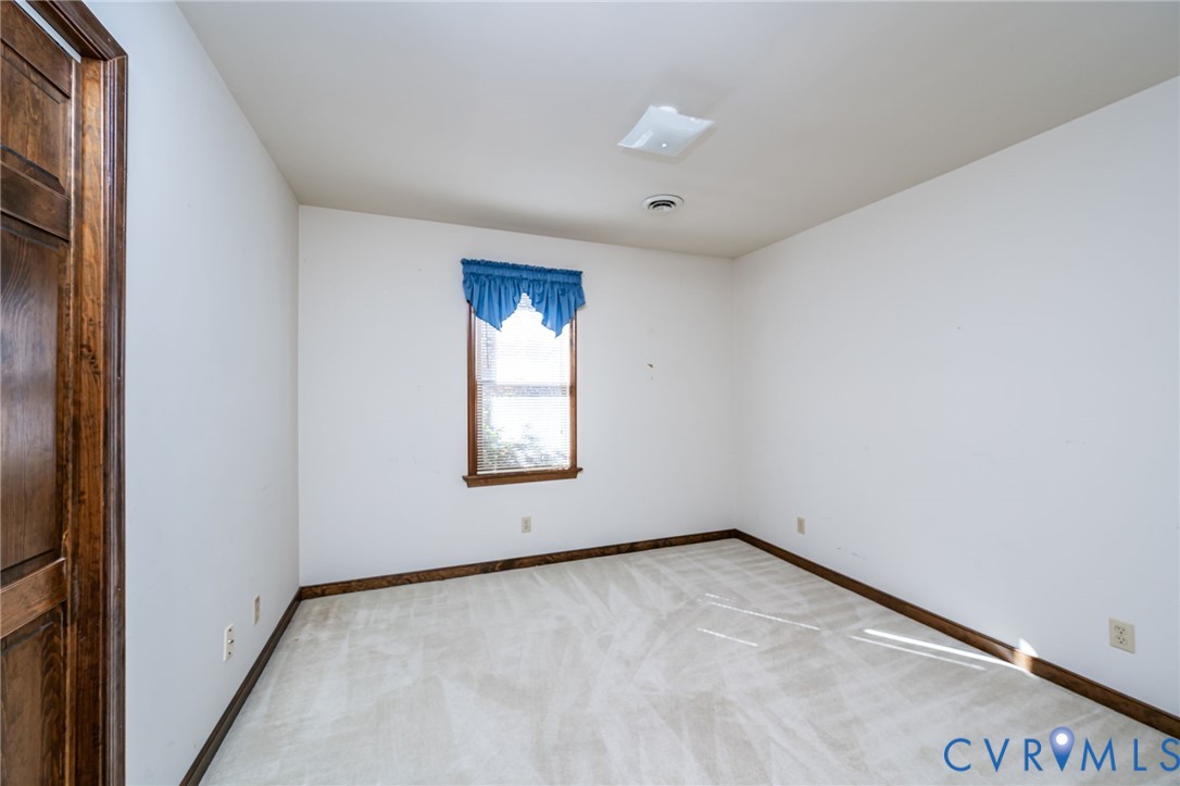 8401 Beaver Bridge Road Moseley, VA 23120 - Photo 19 of 34 an empty room with a window