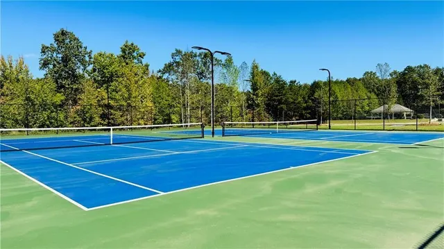 a view of an outdoor space and tennis court