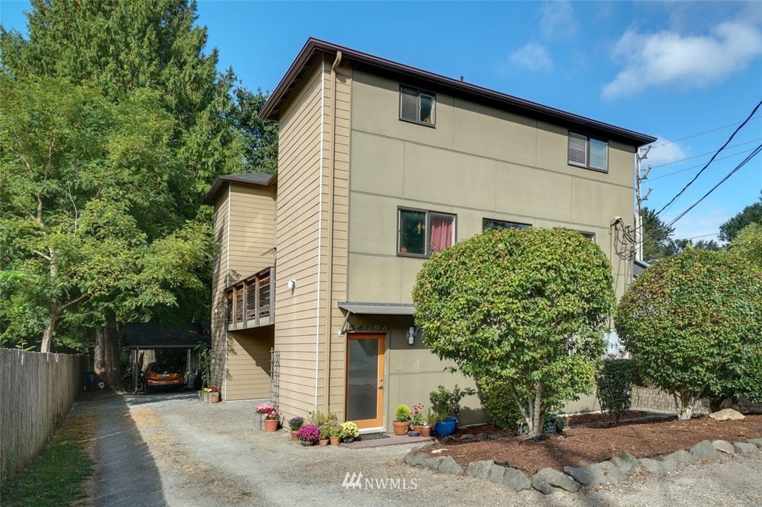 5409 26th Avenue Southwest, Unit B Seattle, WA 98106 - Photo 1 of 31 a view of a house with a yard