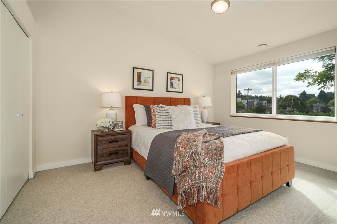 5409 26th Avenue Southwest, Unit B Seattle, WA 98106 - Photo 16 of 31 a bedroom with a bed and window