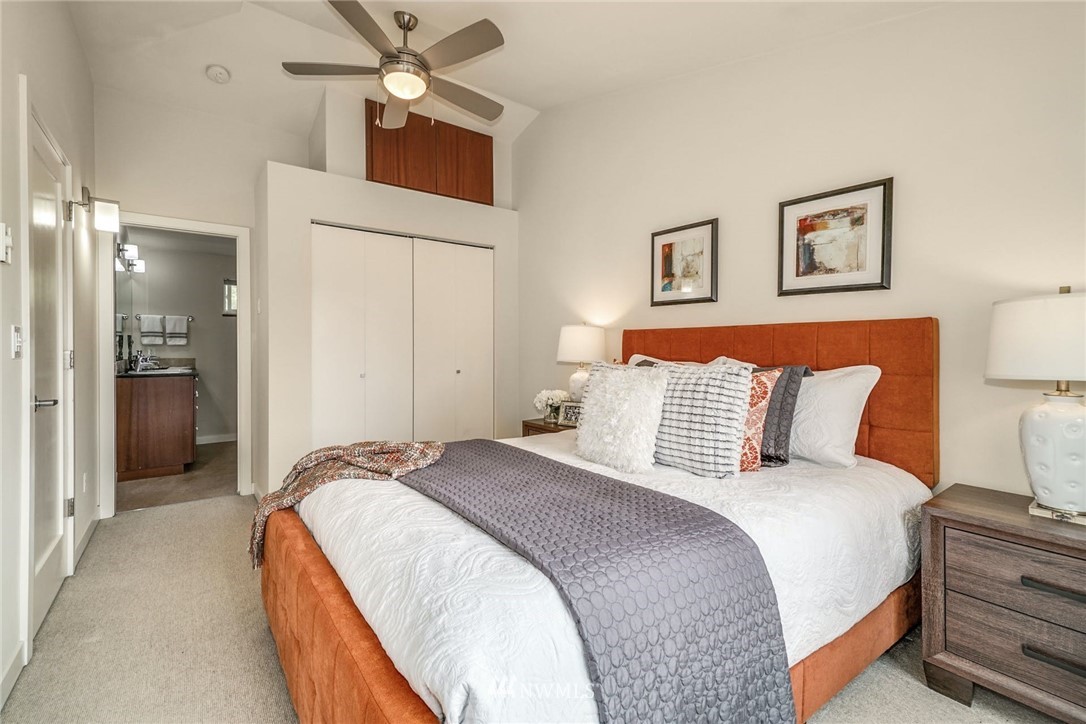 5409 26th Avenue Southwest, Unit B Seattle, WA 98106 - Photo 17 of 31 a bedroom with bed and ceiling fan