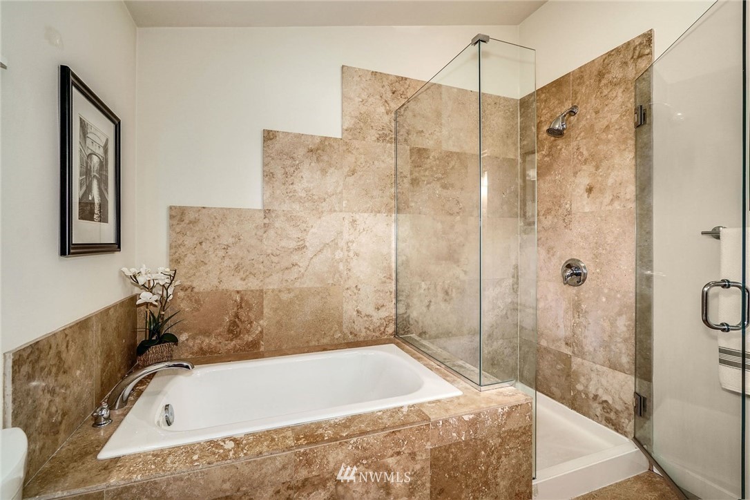5409 26th Avenue Southwest, Unit B Seattle, WA 98106 - Photo 19 of 31 a bathroom with a tub and shower