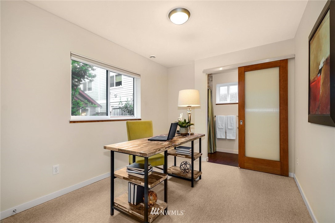 5409 26th Avenue Southwest, Unit B Seattle, WA 98106 - Photo 24 of 31 a view of a workspace with furniture and a window