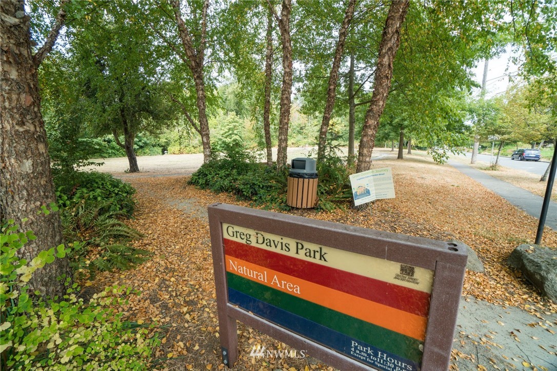 5409 26th Avenue Southwest, Unit B Seattle, WA 98106 - Photo 28 of 31 a view of a park with trees and flowers